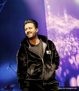 Atif Aslam in black coat